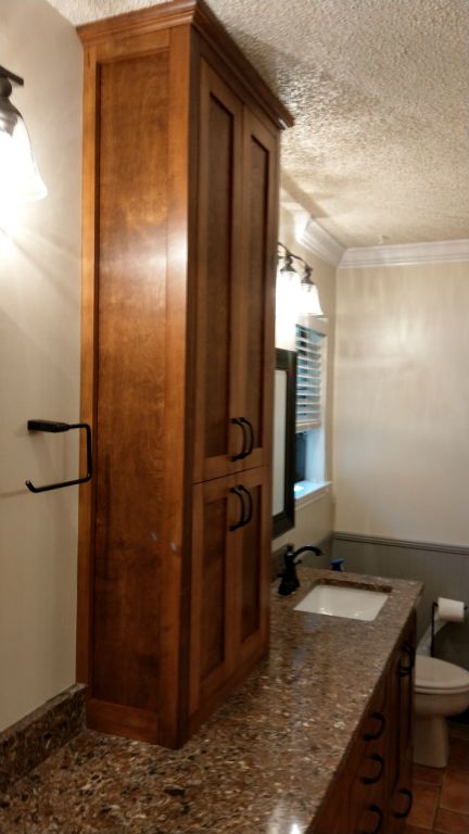 Master Bath European Frameless Shaker with Above Counter Tower. All Maple Facing with Hand Staining (Color customized to match existing furniture)