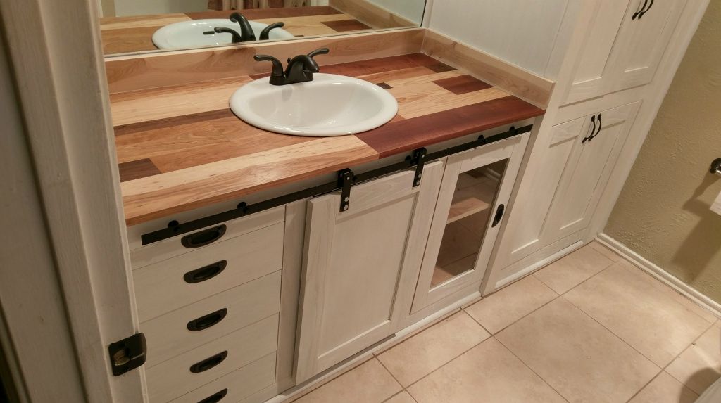 Guest Bath White Stain On White Oak with Custom Barn Door.  Mixed Hardwood Countertop (Mahogany,  Walnut,  Hickory,  Cherry, Maple Backsplash).